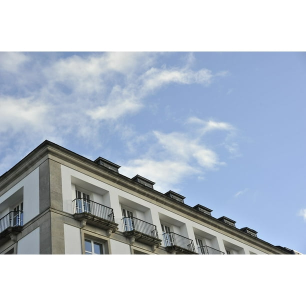 Colorful Building and Bright Blue Sky Poster